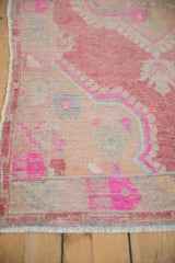 Distressed vintage Oushak rug texture, with fuchsia, raspberry red, and slate blue patterns.
