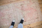 A personal view of the distressed texture on a vintage Oushak runner.