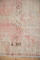 Reverse side of a vintage Turkish rug showing the hand-knotted foundation and painted numbers.