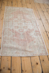 Vintage distressed Oushak runner end, showing wear, short fringe, and fine striations.