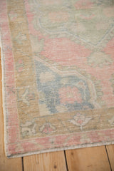 Detail of the vintage Turkish Oushak's even wear, with the low pile showing knot heads.