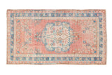 Distressed vintage Oushak rug, dusty pink and turquoise floral medallion, with even wear, 2'6