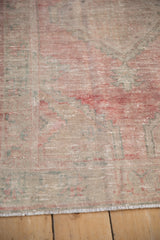 Vintage Distressed Oushak rug showing low pile texture with soft dusty raspberry, ivory, and oxidized silver hues.