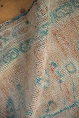 Soft, heavy construction and plush wool texture of a vintage distressed Turkish Oushak.