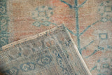 Heavy hand-knotted back and evenly worn pile of a vintage Turkish Oushak rug corner.