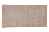 Vintage distressed Oushak rug with a geometric border and open field in a faded, tone-on-tone silver palette.