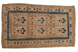 Distressed vintage Afghani rug with triple panels, geometric plant motifs, and sapphire blue borders, 4'4
