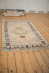 Vintage Distressed Oushak rug corner, stepped geometric motif with heavy abrashes, dusty blue, brown hues.