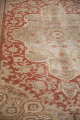 Vintage distressed Anatolian rug, red arabesques and faded ivory pomegranate spandrel.