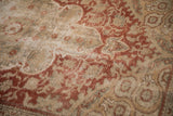 Distressed Anatolian rug with time-softened pile and red, ivory, oxidized silver arabesques.