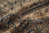 Folded distressed Hamadan rug with worn pile, beige, sand, cobalt blue Herati and serpent motifs.