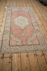 Vintage Distressed Oushak runner with serpent and serrated leaf border, dusty blush field.