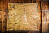 Pre-Civil War pull down map of New York State on aged canvas with red county lines.