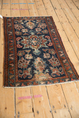 Vintage Mehreban rug corner with floral palmettes, madder root border, and visible foundation wear.