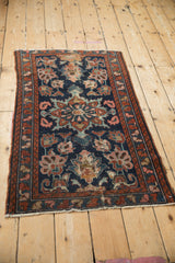 Vintage Mehreban rug close-up: cobalt blue starburst medallion, floral palmettes, visible foundation.