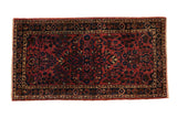 Antique fine Sarouk rug with a dense blossom field in raspberry red and dark sapphire blue.