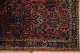 Intricate floral border and side cord selvage on a fine antique Persian Sarouk rug.