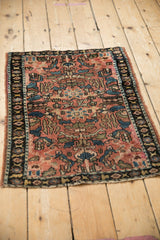 Elevated perspective of an antique Lilihan rug, showing its storied patina and allover floral design.