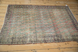 Antique Kerman rug border showcasing patinaed Rococo motifs and distinct edge wear.