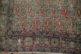 Worn pile and exposed foundation showing intricate boteh and Rococo patterns, with tattered fringe.