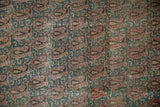 Faded red, jade, and ivory scrolling Rococo leaves and boteh pattern with wear to knot heads.