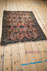 Antique Mehriban rug in dusty rose, allover palmette Herati design, visible wear, tattered ends.