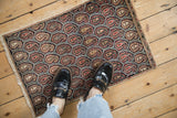 Vintage Farahan Sarouk mat: staggered repeating boteh pattern in navy, brick red, dusty teal.