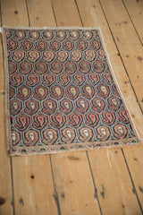 Vintage Farahan Sarouk rug mat corner with repeating boteh pattern and minor border.
