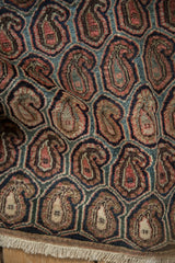 Vintage Farahan Sarouk rug fragment, textured pile, staggered brick red boteh, dusty teal.