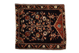 Antique Farahan Sarouk square rug with a blossomed tree of life design on a dark navy blue field.