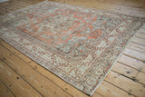 Distressed vintage Turkish Sparta carpet with terracotta, beige, and powder blue vinery patterns.