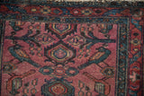 Antique Persian Lilihan runner detail: raspberry red field, teal bird motifs, and border wear.