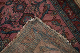 Antique Lilihan runner's hand-knotted foundation and fringed edge texture, with magenta field.