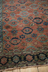 Antique Bibikabad rug's copper field with Veramin floral design, sapphire blue, teal, and patterned border.