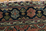 Antique Bibikabad rug border featuring sapphire blue, copper floral motifs, delicate vines, and even wear.