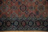 Antique Bibikabad rug's copper field and main border, displaying Veramin-inspired floral lattice and variegated tones.