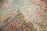 Vintage Kaisary rug's folded corner, showing oxidized silver pile and blue-rust selvage.