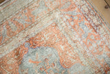 Soft mercerized pile of a vintage Kaisary rug with terracotta and oxidized silver motifs.