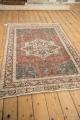 Angled perspective of the distressed vintage Sparta rug showing its decorative wear and pattern.