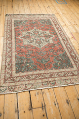 Angled view of a vintage distressed Sparta rug with its starburst medallion.