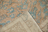 Textured ochre and sky blue distressed Sparta rug pile, showing machine-bound beige reverse.