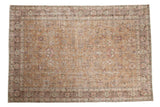 Distressed vintage Sparta carpet with an allover floral design in coffee brown, blush pink, and sage.