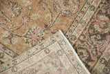 Corner of a vintage Sparta carpet folded over to show the hand-knotted foundation.