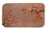 Antique Chinese Art Deco rug, dusty mauve field, corkscrewed branches, embossed cherry blossoms.