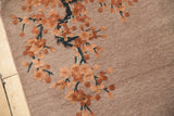 Embossed terracotta cherry blossoms and dusty mauve field on a Chinese Art Deco rug.