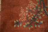 Textured copper pile of antique Art Deco runner, with dusty teal floral vines and varied blooms.