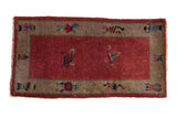 Antique Chinese Art Deco rug runner, raspberry red field, cloudband and Taoist border motifs.