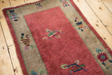 Antique Chinese Art Deco runner, raspberry red field with cloudband and border vase motif.