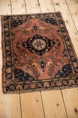 Central floral medallion with germinating finials on an antique Farahan Sarouk rug.