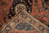 Precise hand-knotting on the reverse, showing intricate floral vinery on brick red pile.